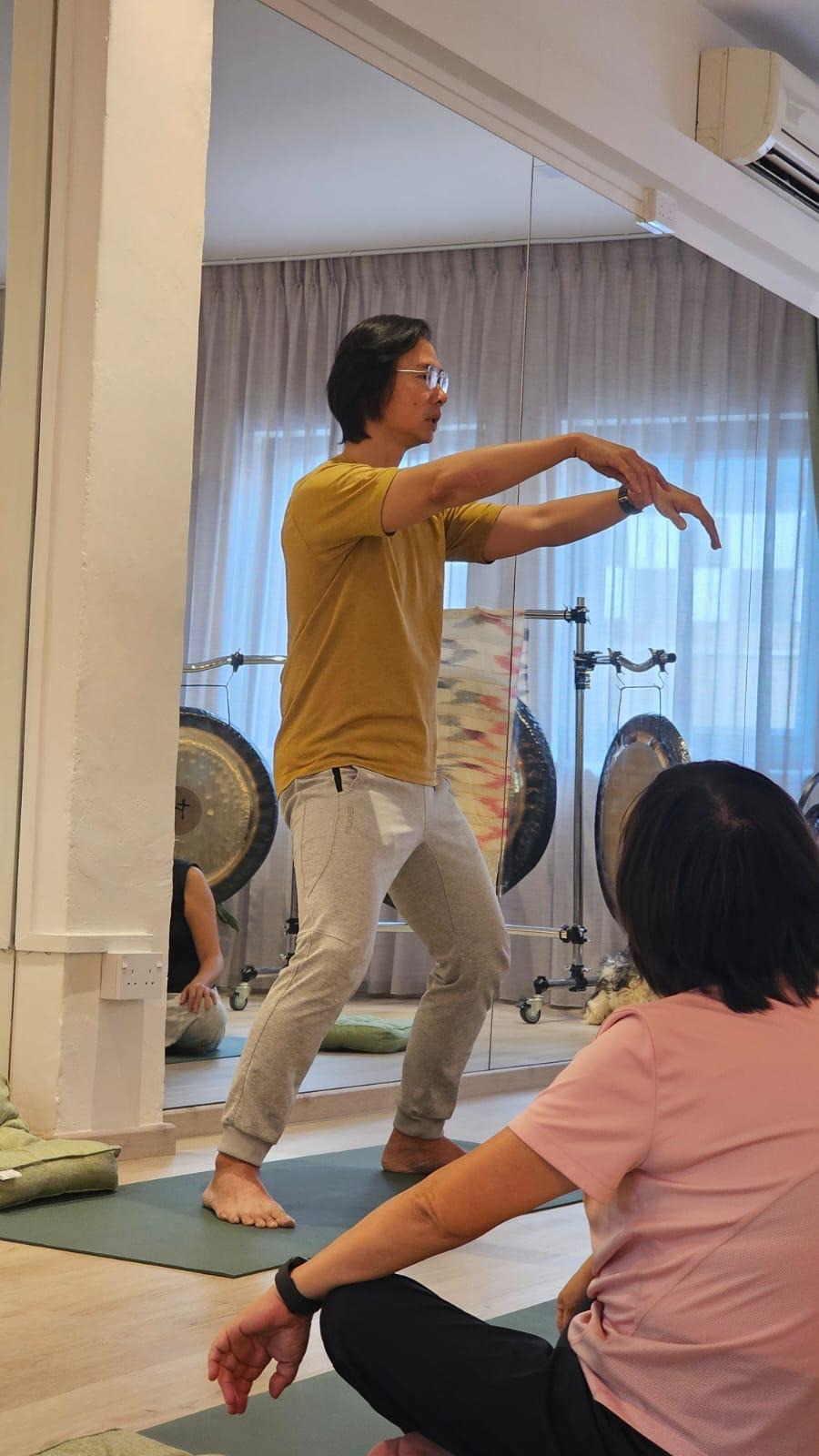 Victor Chng demonstrating a stretch