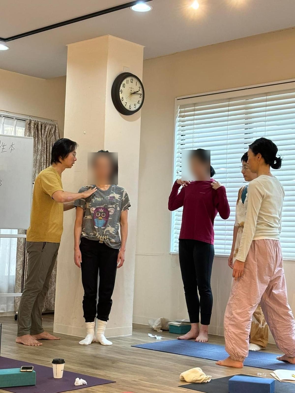 Victor Chng adjusting a student's posture in class